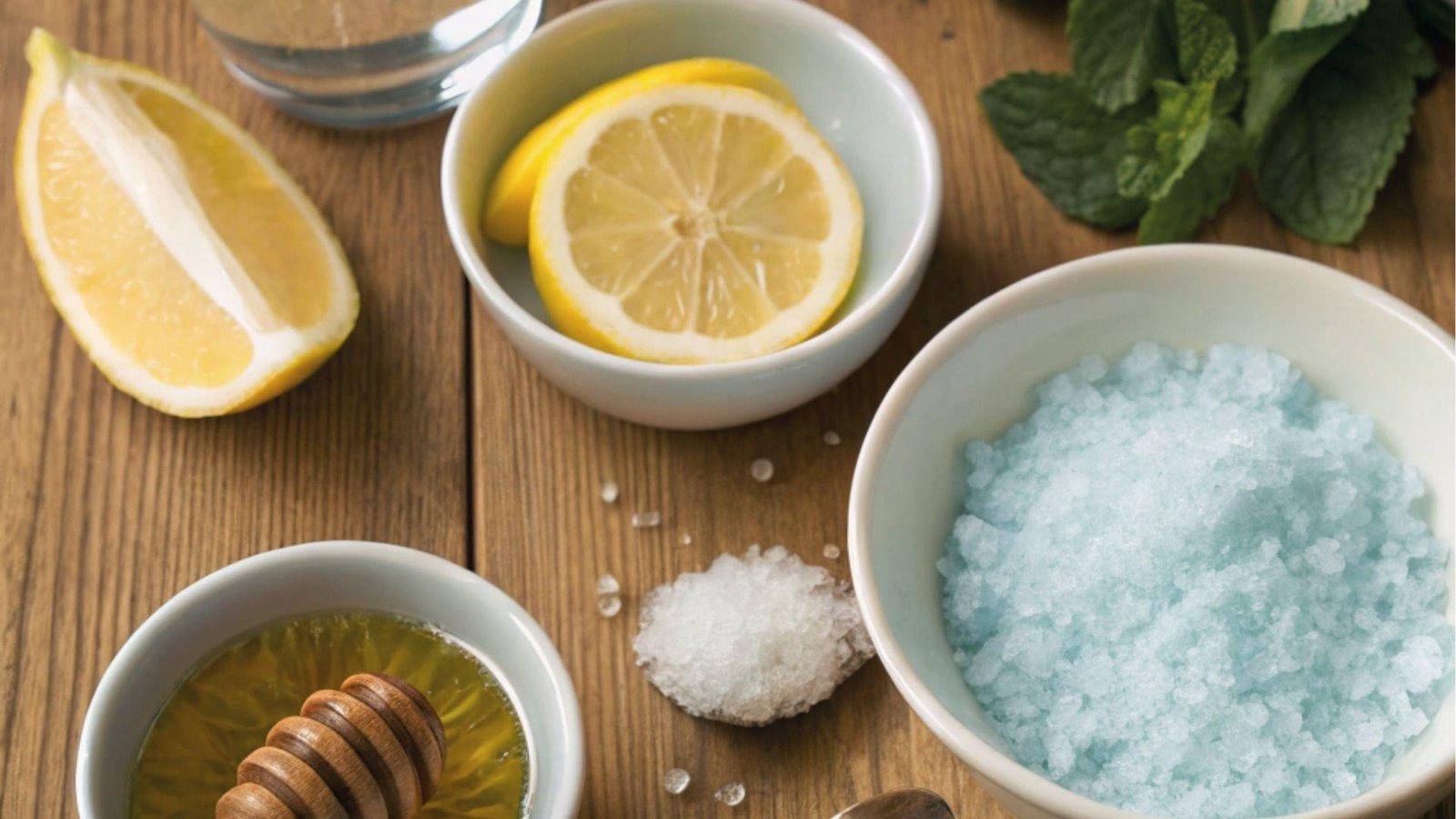 Blue salt trick recipe ingredients blue salt, lemon slices, honey and white salt on wooden table
