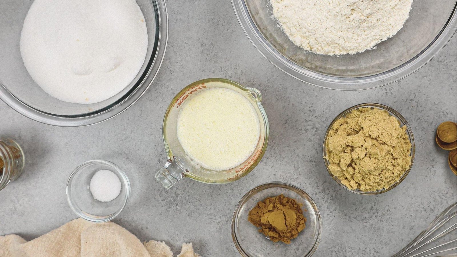 Flat lay of coffee bread recipe ingredients: flour, sugar, brown sugar, and instant coffee.