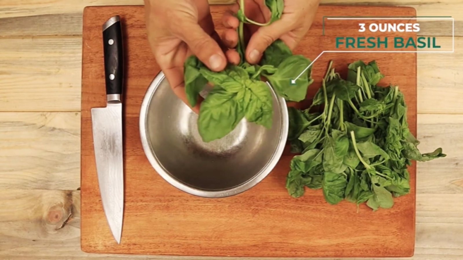 Fresh basil leaves separated from stems, measured for making pumpkin seed pesto recipe.