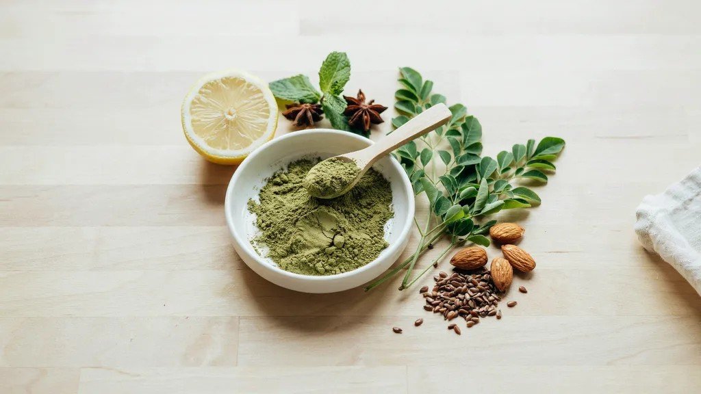 moringa powder and leaves displayed to show its natural superfood benefits.