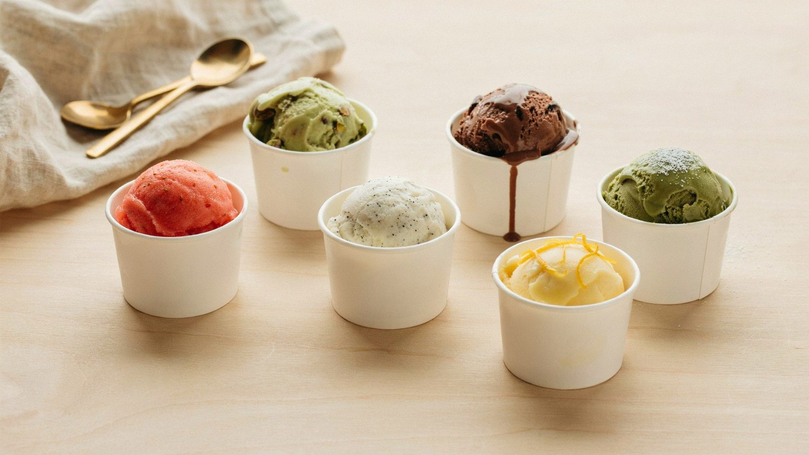 different frozen desserts including gelato ice cream and custard displayed together for comparison.