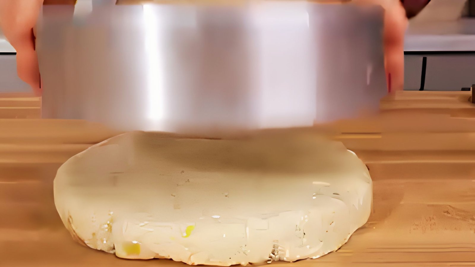 Shaping ginger scone dough into an 8-inch circle on a lightly floured surface before chilling.